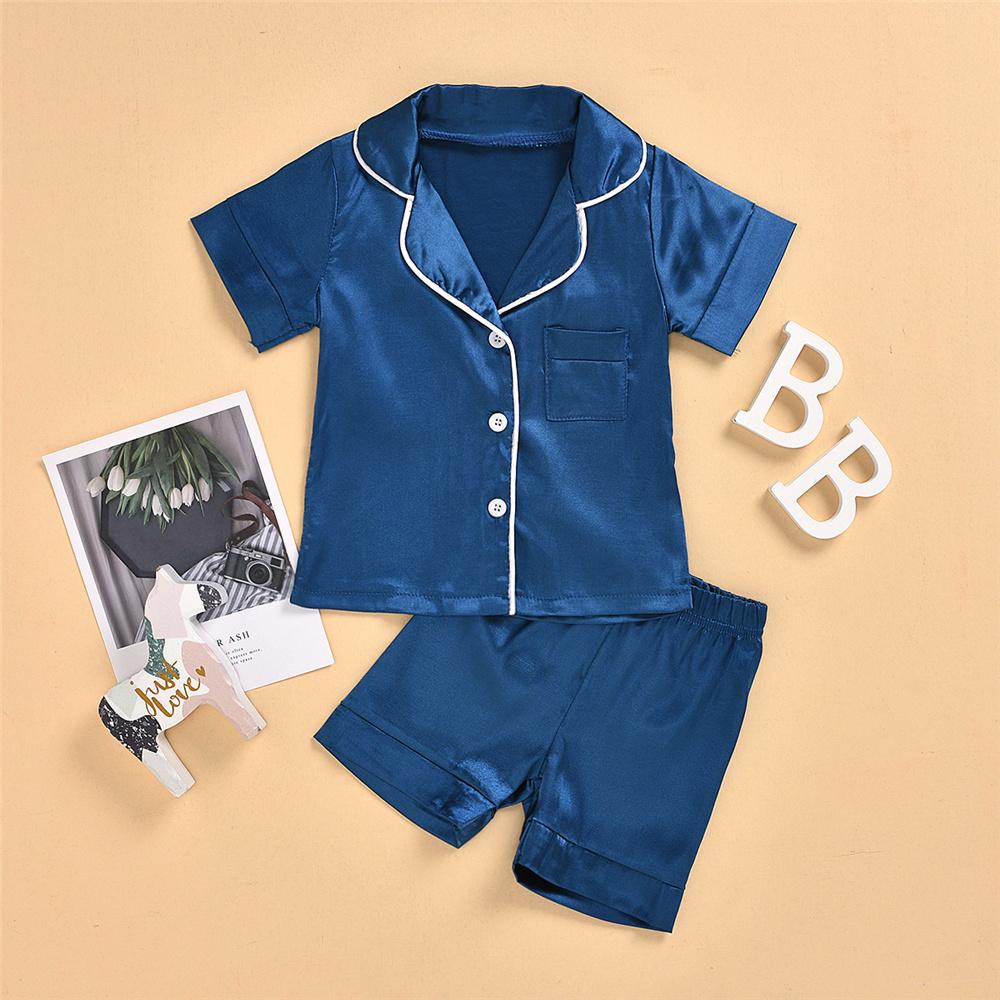 Unisex Solid Color Pajamas Suit Button Short Sleeve Top & Shorts Trendy Kids Wholesale Clothing